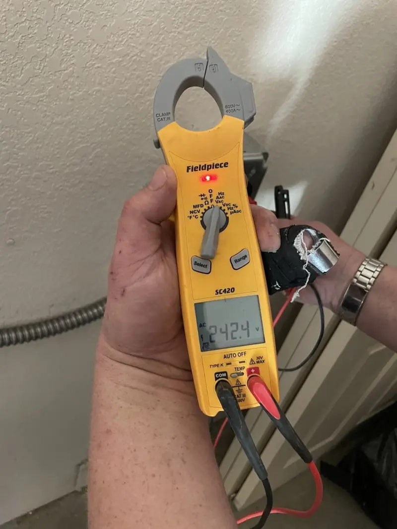 Voltage testing with clamp meter during Hot Tub / Pool Electrical Wiring in Aurora